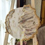 ساعت دیواری دفرمه سفید و طلایی