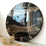 ساعت دیواری مدرن با طرح ژئود ترکیب مشکی و طلایی خاص